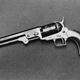 A replica model of an 1851 Colt Navy revolver with a squareback trigger guard, .36 caliber and 7.5 inch long barrel.
